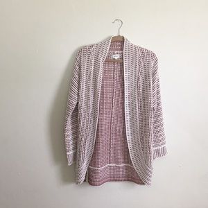 White and light pink, heavy knit cardigan.